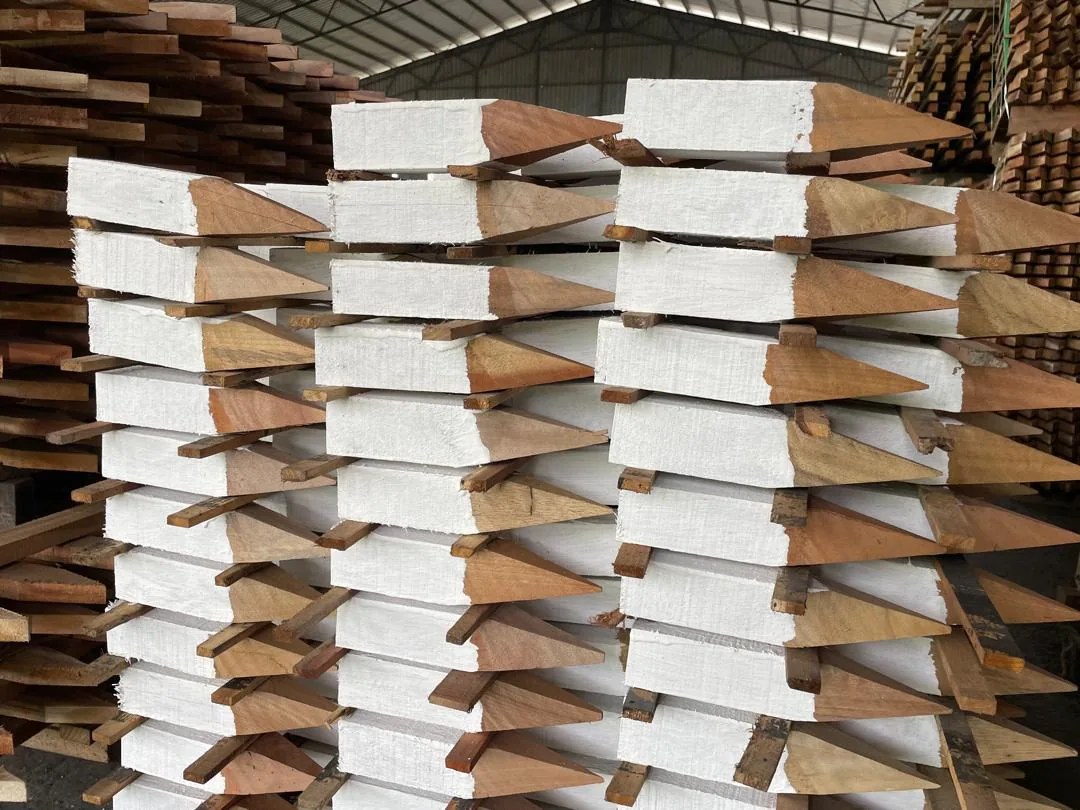 Painted timber stakes with pointed ends